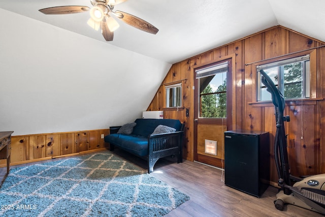 3219 N Pinewood Dr, Pine, AZ 85544 - living area featuring lofted ceiling, wood walls, wood finished floors, and a ceiling fan