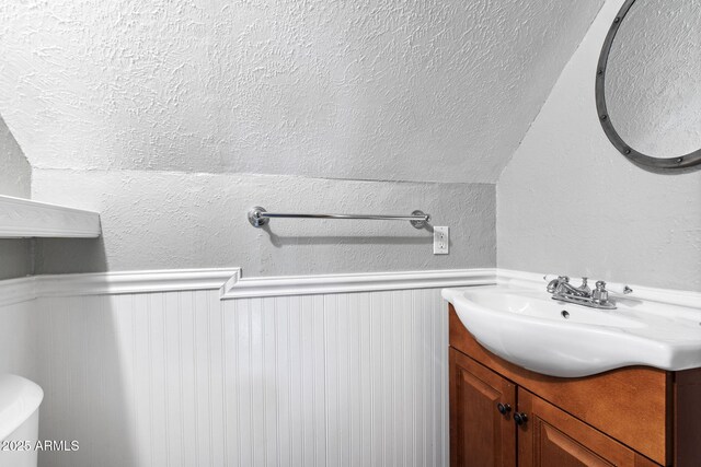 3219 N Pinewood Dr, Pine, AZ 85544 - bathroom with vanity and a wainscoted wall
