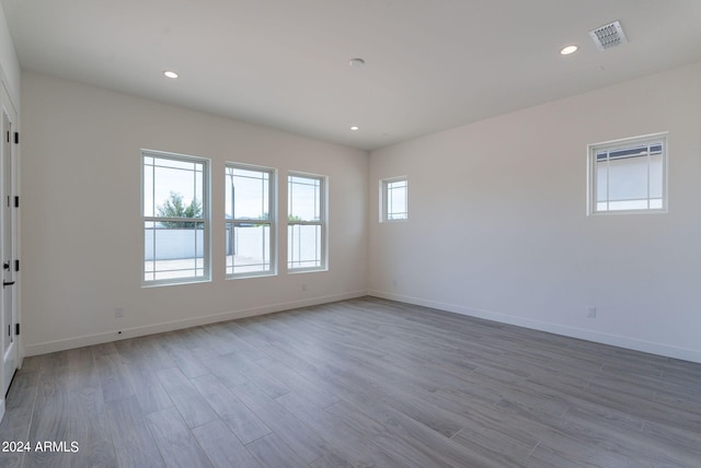 empty room with light hardwood / wood-style floors