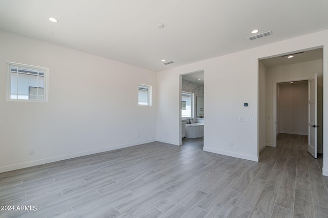 spare room with light hardwood / wood-style flooring