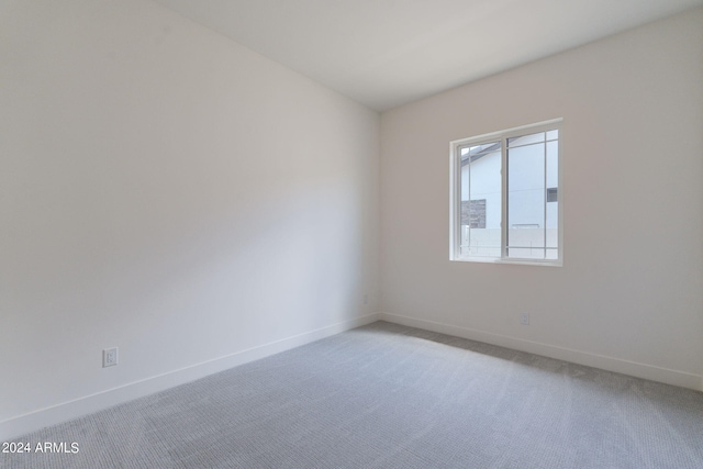 unfurnished room featuring carpet