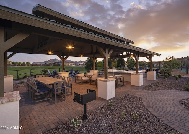 patio terrace at dusk with an outdoor hangout area