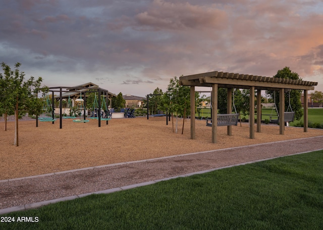 view of home's community with a playground and a yard