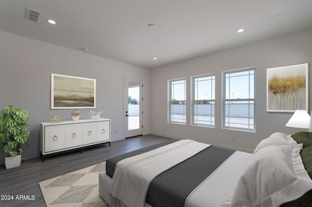 bedroom featuring access to exterior and dark wood-type flooring