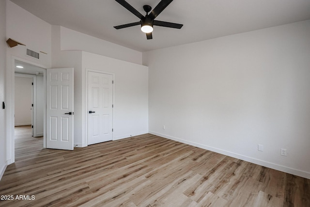 unfurnished bedroom with ceiling fan and light hardwood / wood-style floors
