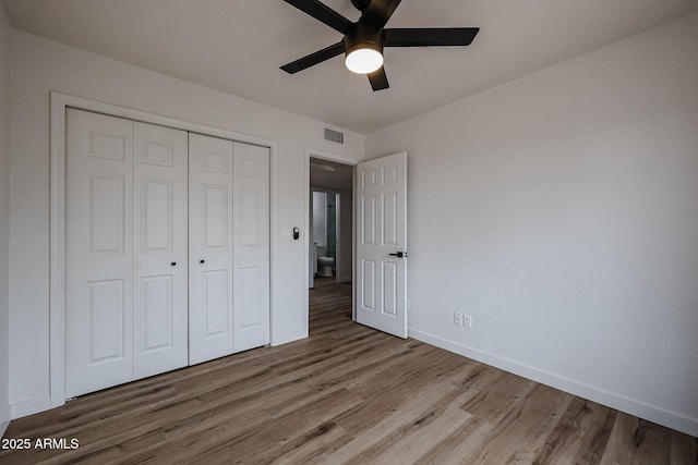 unfurnished bedroom with a closet, ceiling fan, and light hardwood / wood-style floors