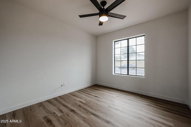 empty room with light wood-type flooring and ceiling fan