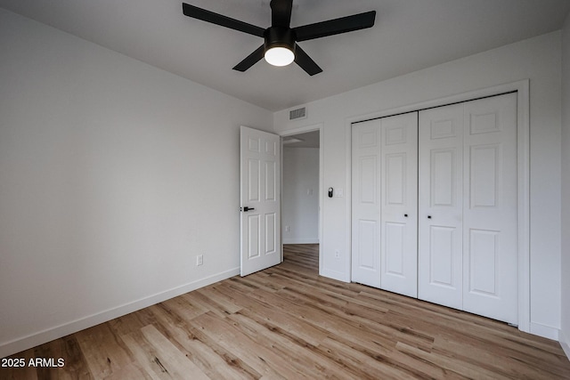 unfurnished bedroom with a closet, ceiling fan, and light hardwood / wood-style floors