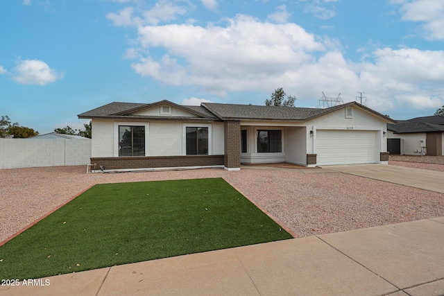 single story home featuring a garage and a front lawn