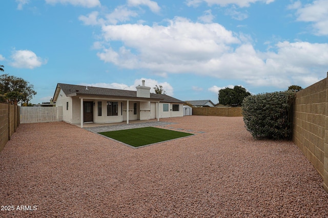 back of house featuring a patio