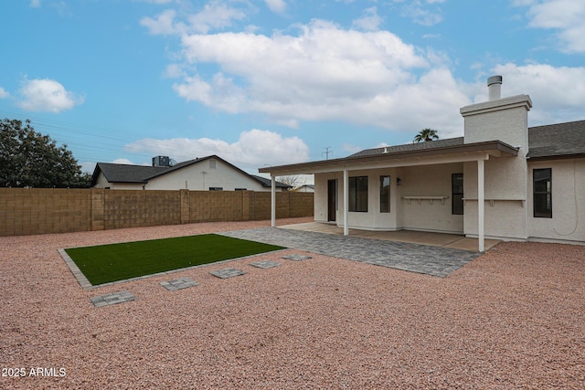 rear view of house with a patio