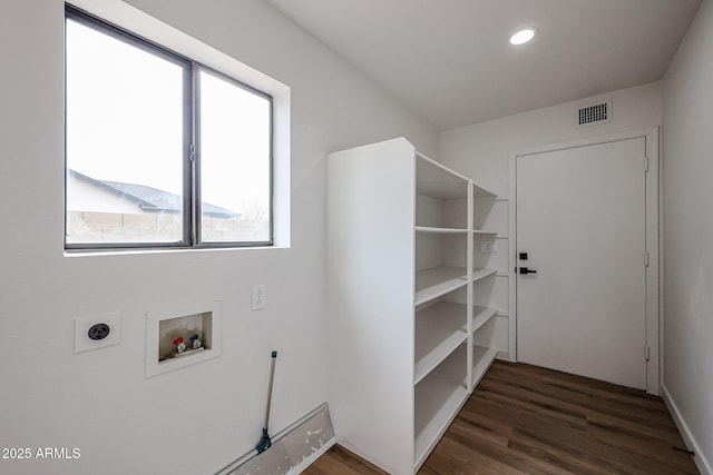 laundry room featuring hookup for an electric dryer, dark wood-type flooring, and hookup for a washing machine