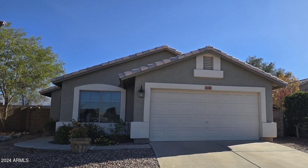 ranch-style home with a garage