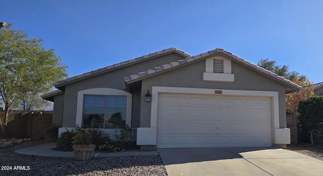 ranch-style home with a garage