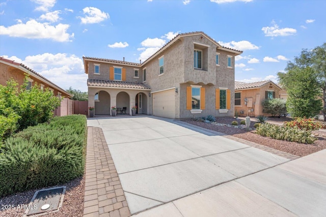 10417 W Alyssa Ln, Peoria, AZ 85383 - mediterranean / spanish house featuring an attached garage, a tile roof, fence, stucco siding, and driveway