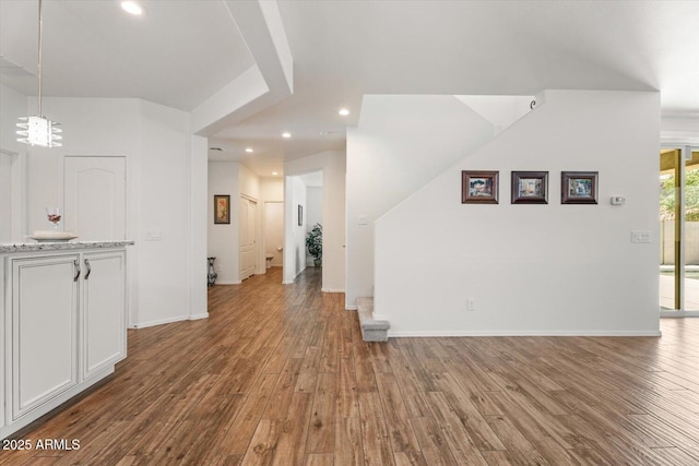 10417 W Alyssa Ln, Peoria, AZ 85383 - unfurnished living room with baseboards, recessed lighting, and wood finished floors