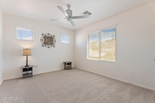 10417 W Alyssa Ln, Peoria, AZ 85383 - spare room featuring light carpet, visible vents, and a healthy amount of sunlight