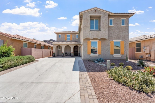 10417 W Alyssa Ln, Peoria, AZ 85383 - mediterranean / spanish-style home featuring driveway, stucco siding, fence, and a tile roof