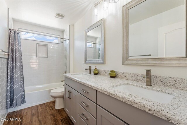 10417 W Alyssa Ln, Peoria, AZ 85383 - full bathroom featuring double vanity, a sink, toilet, and wood finished floors