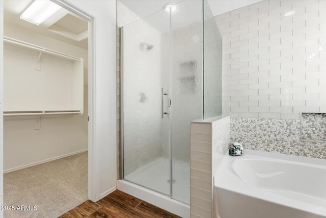 10417 W Alyssa Ln, Peoria, AZ 85383 - full bathroom with a walk in closet, a stall shower, and a garden tub