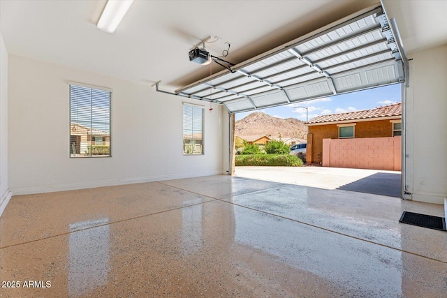 10417 W Alyssa Ln, Peoria, AZ 85383 - garage featuring a garage door opener and baseboards
