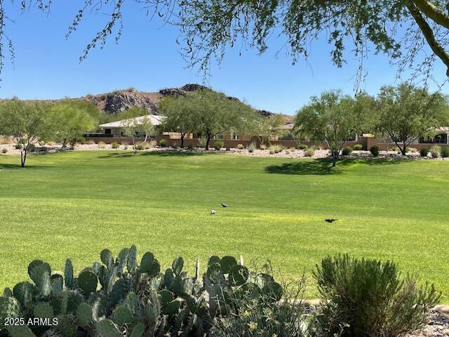 10417 W Alyssa Ln, Peoria, AZ 85383 - surrounding community featuring golf course view, a mountain view, and a lawn