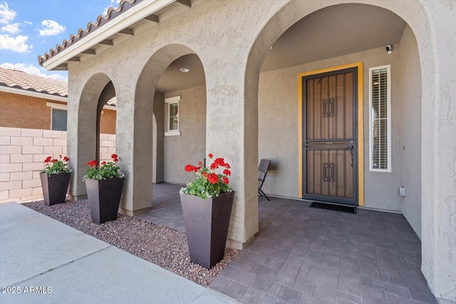 10417 W Alyssa Ln, Peoria, AZ 85383 - property entrance featuring a patio area, stucco siding, fence, and a tile roof
