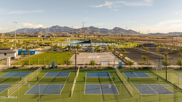 drone / aerial view with a water and mountain view