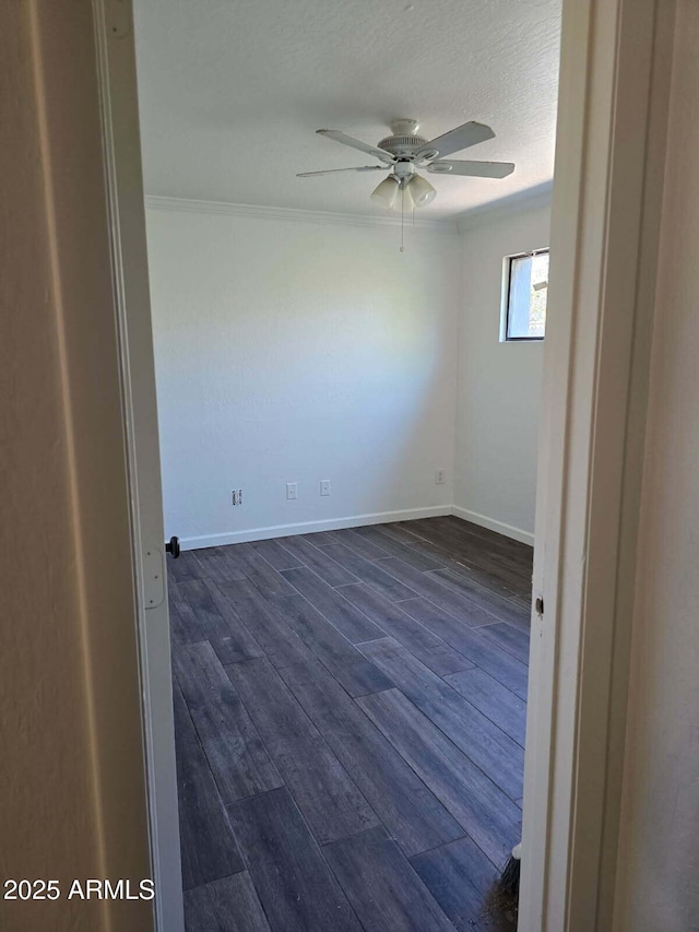 4224 N 12th St Unit 108, Phoenix, AZ 85014 - spare room with ceiling fan, dark wood-style floors, and ornamental molding