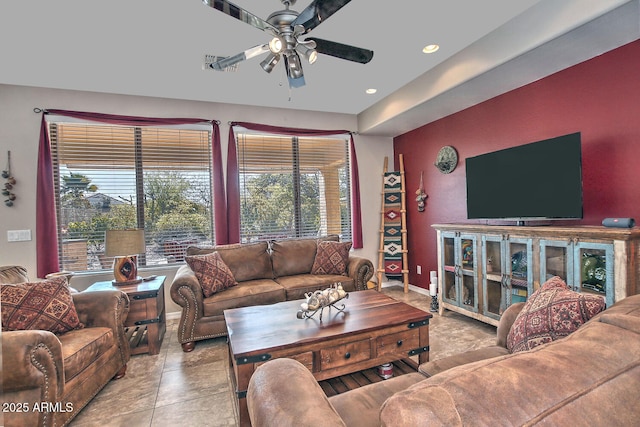 living room featuring a wealth of natural light and ceiling fan