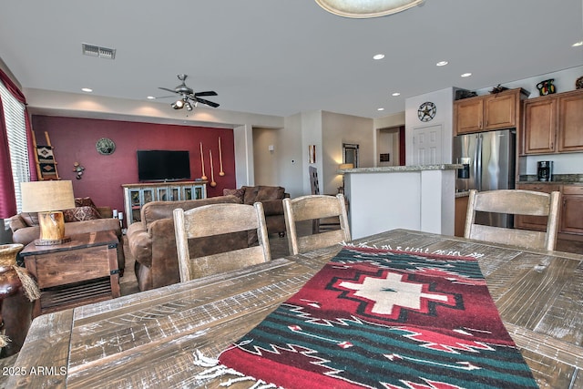 dining area with ceiling fan