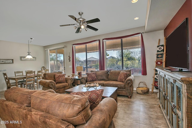 tiled living room featuring ceiling fan