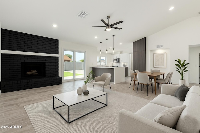 living area featuring visible vents, recessed lighting, light wood finished floors, and ceiling fan