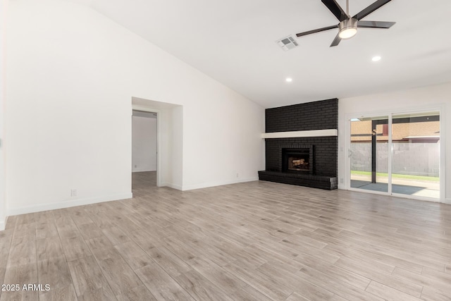 unfurnished living room with a ceiling fan, visible vents, a fireplace, light wood-type flooring, and recessed lighting