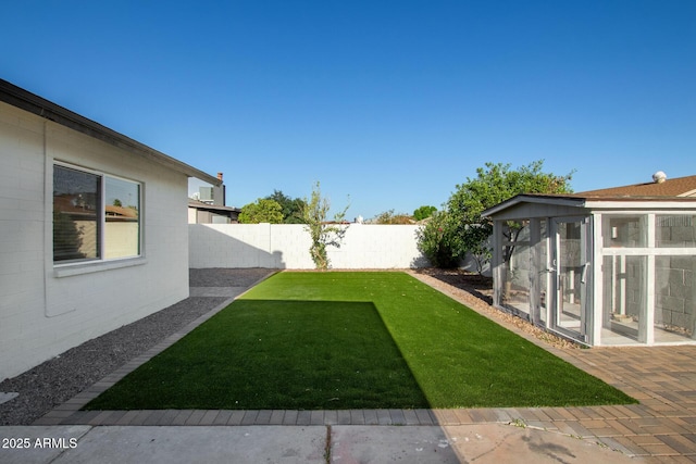 view of yard with a fenced backyard