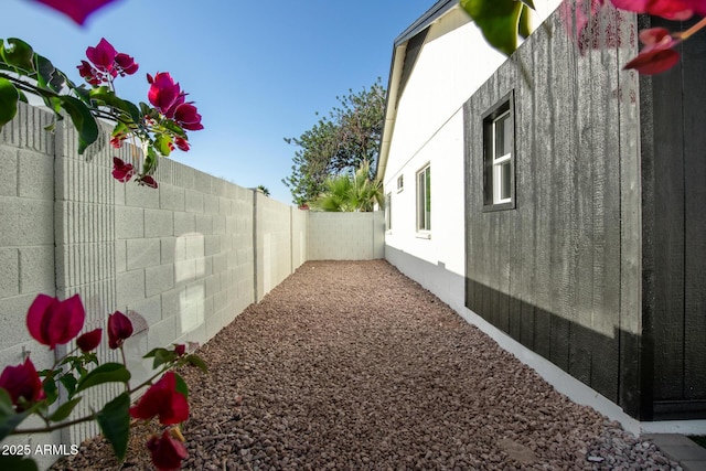 view of side of property with a fenced backyard
