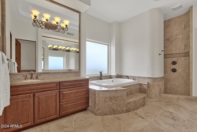 bathroom featuring separate shower and tub, tile floors, a notable chandelier, and oversized vanity