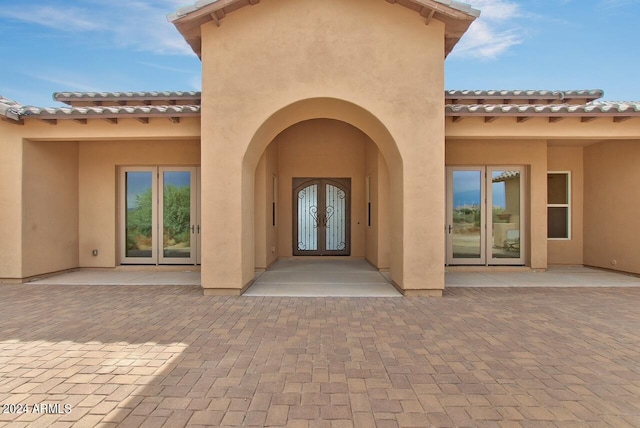 entrance to property featuring french doors