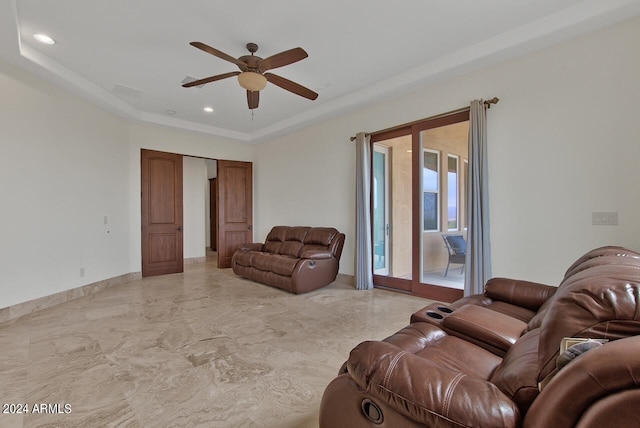 tiled living room with ceiling fan and french doors