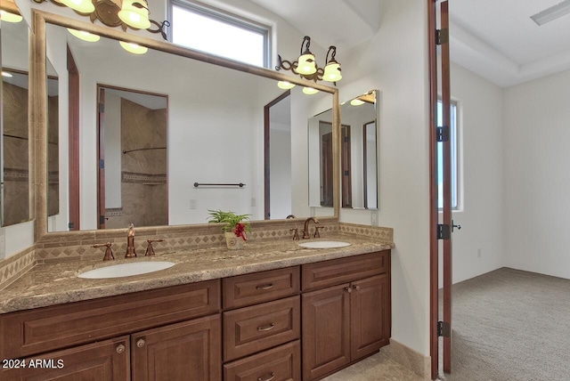 bathroom with dual bowl vanity