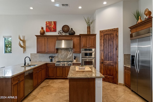 kitchen featuring sink, kitchen peninsula, tasteful backsplash, ventilation hood, and appliances with stainless steel finishes