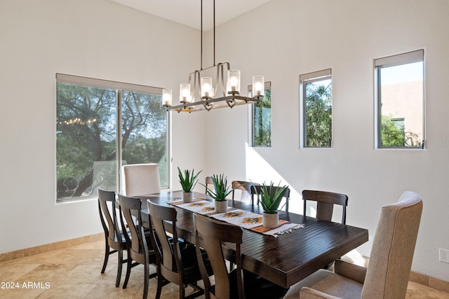 dining space with an inviting chandelier