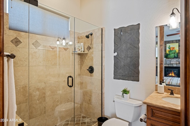 bathroom featuring walk in shower, vanity, and toilet