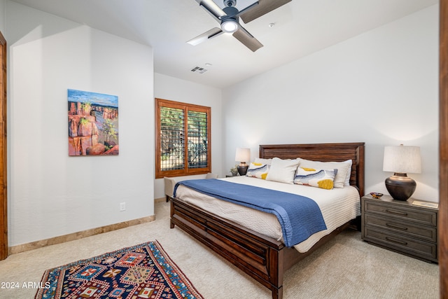 carpeted bedroom with ceiling fan