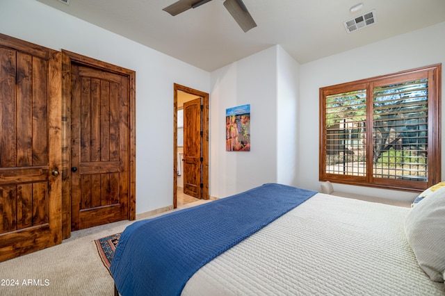 carpeted bedroom featuring ceiling fan