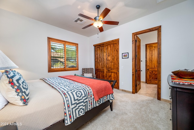 carpeted bedroom featuring ceiling fan