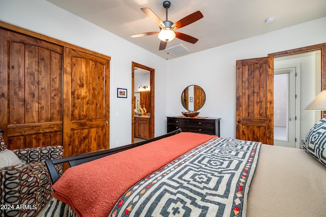 carpeted bedroom with connected bathroom and ceiling fan