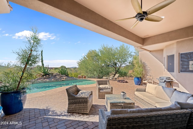 view of patio / terrace with ceiling fan and an outdoor hangout area