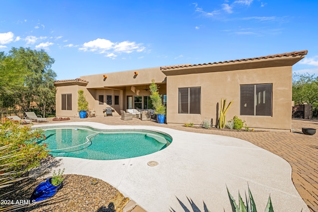 view of swimming pool with a patio area