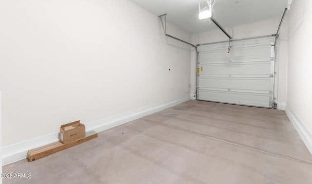 garage featuring baseboards